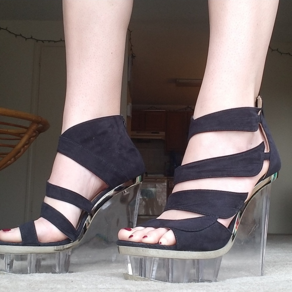 Black stilettos with clear heel.